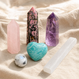 Heart Harmony Crystal Set: six themed Spirit Magicka crystals arranged together on cream linen.