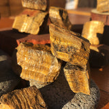 Working On Tigerās Eye Rough Stone - rawstone