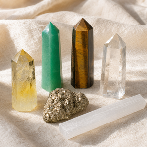 Prosperity Power Crystal Set: six themed Spirit Magicka crystals arranged together on cream linen.